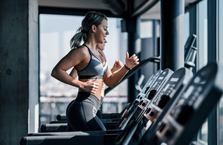 a woman running at the gym
