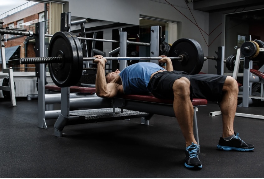 a man doing bench press